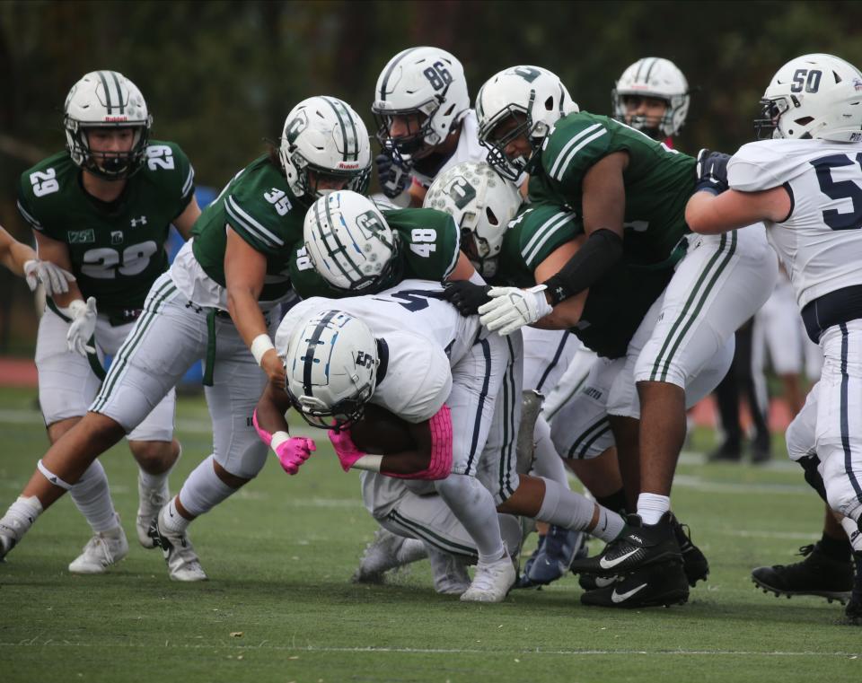 The Delbarton defense stops Mylesa Thmason of Seton Hall Prep in the first half as Seton Hall Prep played Delbarton in football on October 16, 2021 at Delbarton in Morristown.