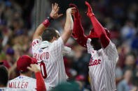 Philadelphia Phillies' Didi Gregorius, right, and J.T. Realmuto celebrate after Gregorius' three-run home run off Pittsburgh Pirates pitcher Chasen Shreve during the seventh inning of a baseball game, Friday, Sept. 24, 2021, in Philadelphia. (AP Photo/Matt Slocum)