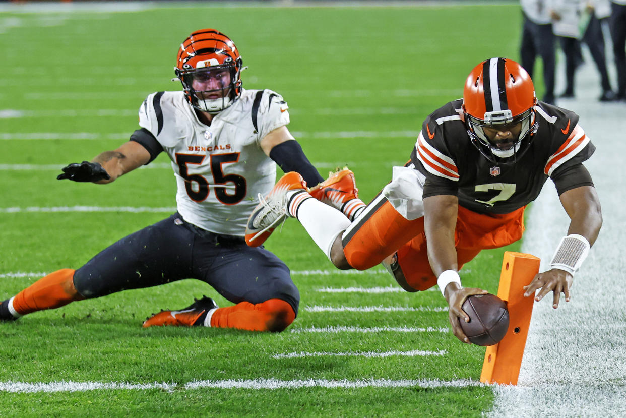 Cleveland Browns quarterback Jacoby Brissett (7) dives into the end zone for a touchdown with Cincinnati Bengals linebacker Logan Wilson (55) looking on Monday in Cleveland. (AP Photo/Ron Schwane)