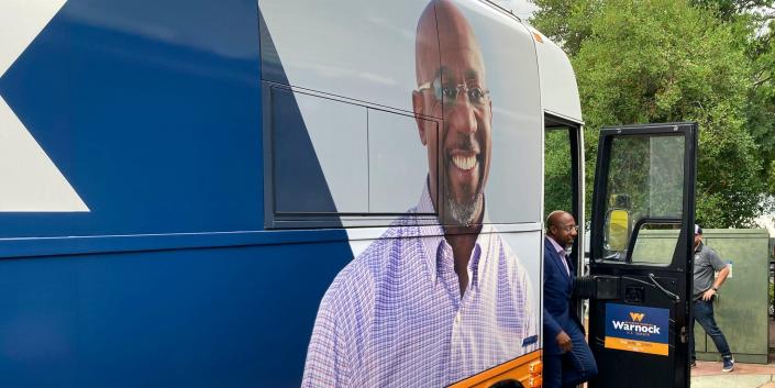 U.S. Sen. Raphael Warnock arrives for a rally in Conyers, Ga., on Thursday, Aug. 18, 2022.