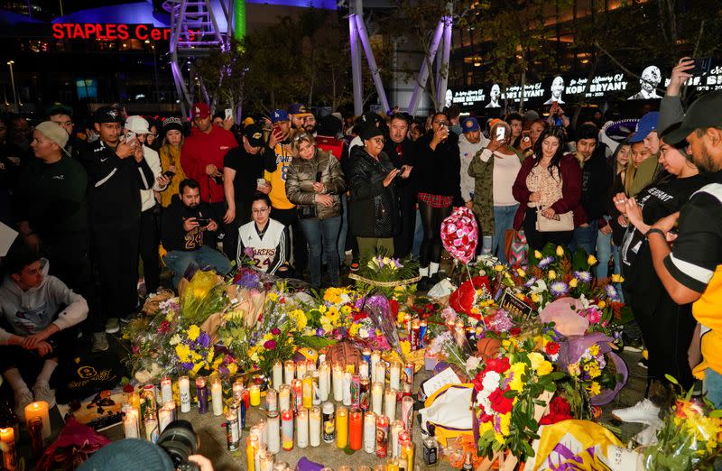 Mourners gather in Microsoft Square near the Staples Center to pay respects to Kobe Bryant after a helicopter crash killed the retired basketball star, in Los Angeles