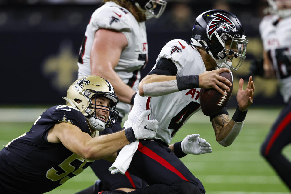 New Orleans Saints linebacker Kaden Elliss (55) sacks Atlanta Falcons quarterback Desmond Ridder (4) in the second half of an NFL football game in New Orleans, Sunday, Dec. 18, 2022. (AP Photo/Butch Dill)
