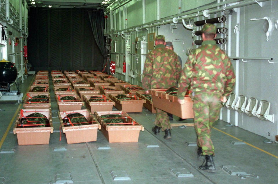 A photo taken on September 29, 1994 shows Finnish Army recruits carrying victims of the MS Estonia ferry disaster into an amphibious landing craft for transfer from the island of Uto to the mainland.  / Credit: MARKKU ULANDER/AFP via Getty Images