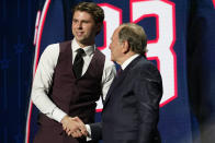 FILE - Columbus Blue Jackets first round pick Adam Fantilli shakes hands with commissioner Gary Bettman during the NHL hockey draft, Wednesday, June 28, 2023, in Nashville, Tenn. The skilled center won the Hobey Baker Award as the top college player after putting up nearly two points a game last season and is expected to play right away with the Blue Jackets.(AP Photo/George Walker IV, File)