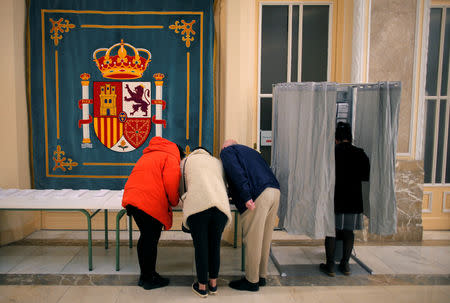 People prepare to cast their votes during Spain's general election in Madrid, Spain, April 28, 2019. REUTERS/Jon Nazca