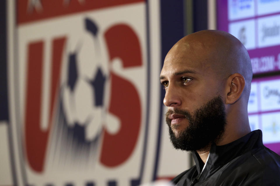 FILE - United States goalkeeper Tim Howard talks to reporters before a training session in Sao Paulo, Brazil, June 28, 2014. Tim Howard will join Tony Meola, Kasey Keller and Brad Friedel on Saturday, May 4, 2024, as modern-era American goalkeepers in the U.S. National Soccer Hall of Fame. (AP Photo/Julio Cortez, File)