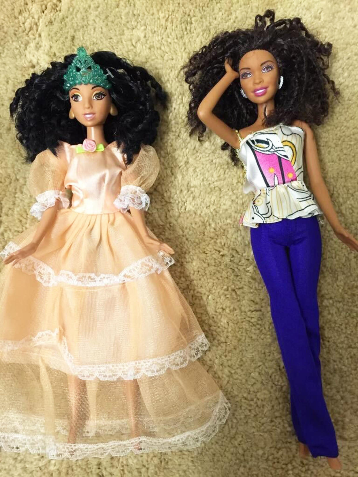 Angela Williams shows off two of her daughter's Barbie dolls. (Courtesy Angela Williams)