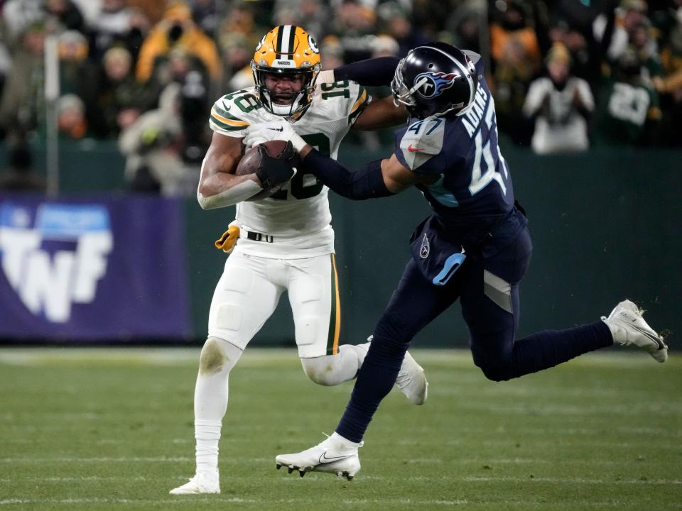 Randall Cobb fights off a defender against the Tennessee Titans.