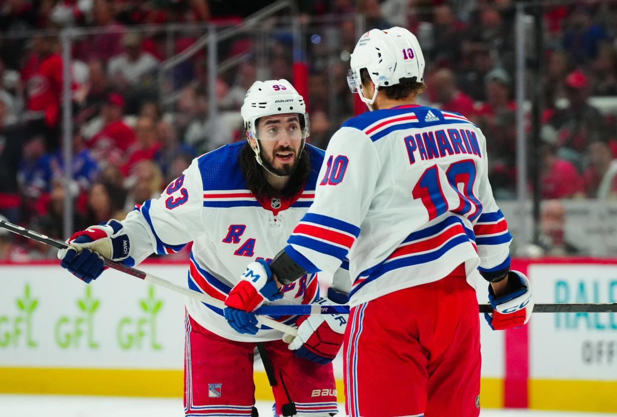 May 9, 2024; Raleigh, North Carolina, USA; New York Rangers center Mika Zibanejad (93) and left wing Artemi Panarin (10) talks against the Carolina Hurricanes during the second period in game three of the second round of the 2024 Stanley Cup Playoffs at PNC Arena.
