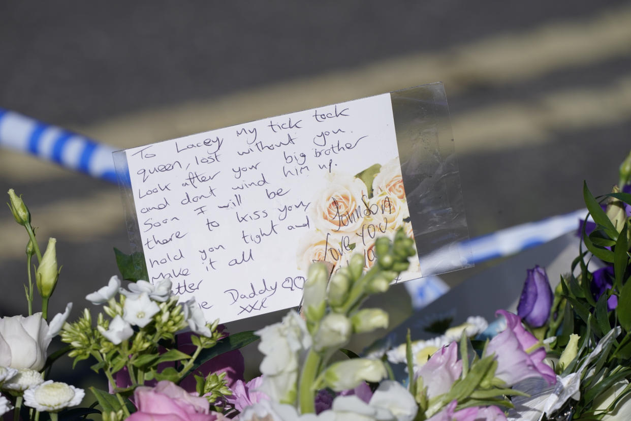 Messages left by the father to one of the victims on bouquets of flowers at the scene in Chandos Crescent, Killamarsh, near Sheffield, where four people were found dead at a house on Sunday. Derbyshire Police said a man is in police custody and they are not looking for anyone else in connection with the deaths. Picture date: Monday September 20, 2021.