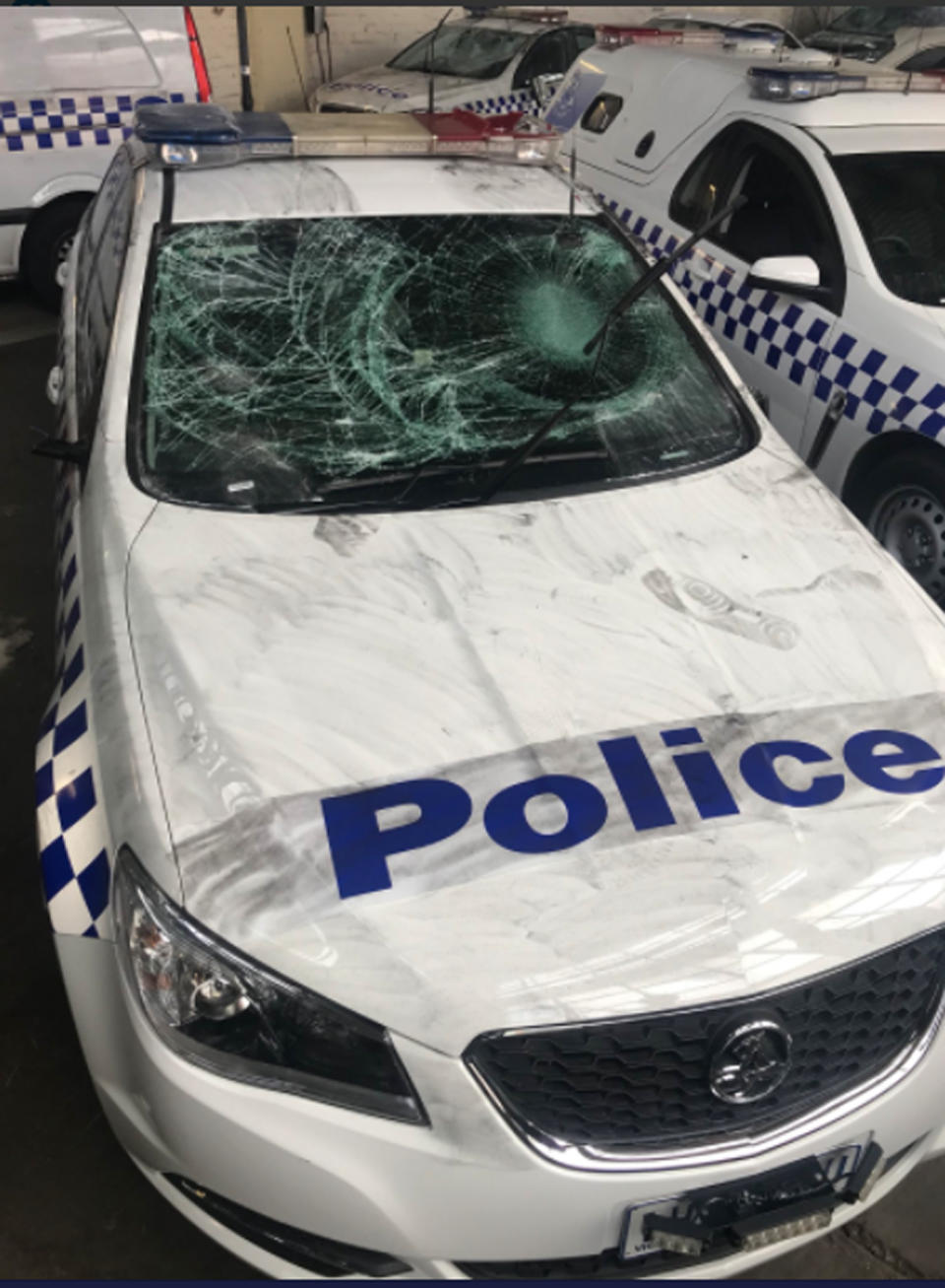 Investigations are underway after four police cars were damaged in North Melbourne. Source: @pauldowsley7/ Twitter