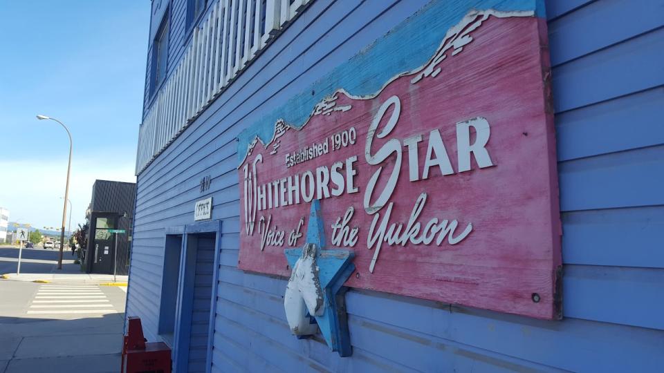 In front of the Whitehorse Star newspaper office in Whitehorse.