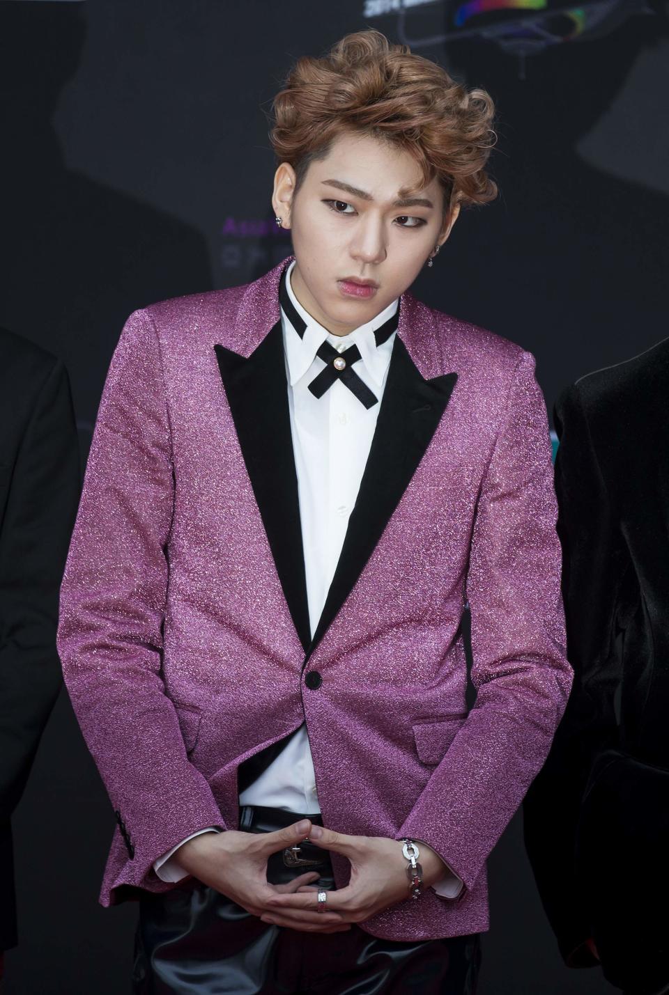 Zico, a member of the South Korean pop band Block B, poses on the red carpet as he attends the 2014 Mnet Asian Music Awards (MAMA) in Hong Kong