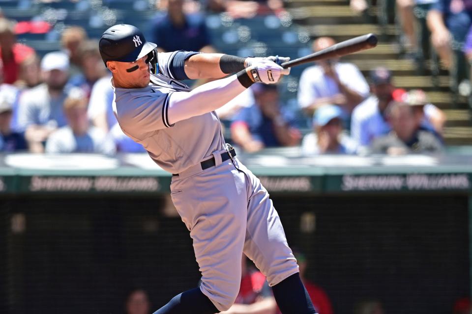 New York Yankees' Aaron Judge hits a double in the sixth inning in the first baseball game of a doubleheader against the Cleveland Guardians, Saturday, July 2, 2022, in Cleveland. (AP Photo/David Dermer)