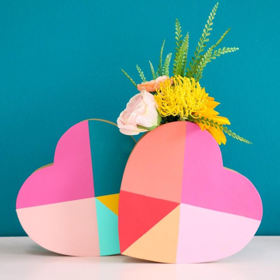 <p>These gorgeous painted hearts are hiding glass vases, and they're way easier to make than they look thanks to paper mache heart boxes.</p><p>Get the <a href="https://akailochiclife.com/2020/01/how-to-make-geometric-heart-flower-vases.html" rel="nofollow noopener" target="_blank" data-ylk="slk:Geometric Heart Flower Vases tutorial;elm:context_link;itc:0;sec:content-canvas" class="link "><strong>Geometric Heart Flower Vases tutorial</strong></a> at a Kailo Chic Life.</p><p><a class="link " href="https://www.amazon.com/Bulk-Buy-Darice-Crafts-2833-32/dp/B00KHASMRQ/?tag=syn-yahoo-20&ascsubtag=%5Bartid%7C10070.g.2138%5Bsrc%7Cyahoo-us" rel="nofollow noopener" target="_blank" data-ylk="slk:Shop Now;elm:context_link;itc:0;sec:content-canvas">Shop Now</a></p>