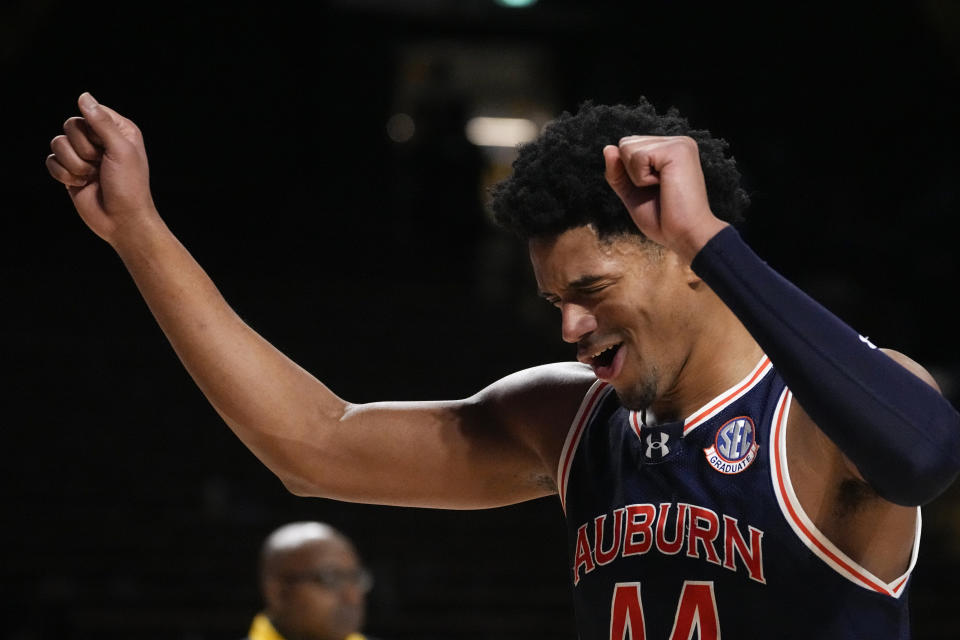 Auburn center Dylan Cardwell (44) celebrates the team's 80-65 win against the Vanderbilt after an NCAA college basketball game Wednesday, Jan. 17, 2024 in Nashville, Tenn. (AP Photo/George Walker IV)