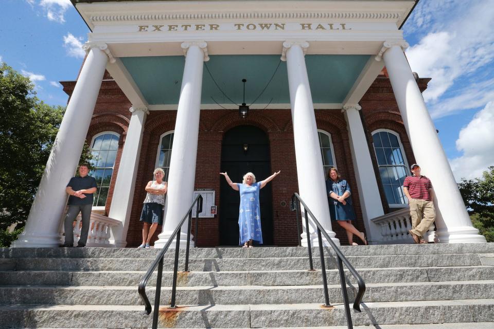 Exeter's rich history remains apparent as the town evolves into a hotspot of dining and present day growth. Standing at the historic town hall from left are Water Street Bookstore owner Dan Chartrand, Exeter Chamber of Commerce Renee Weiland, Bobbi Vandenbulcke, Jennifer Wheeler and Darren Winham, economic development director.