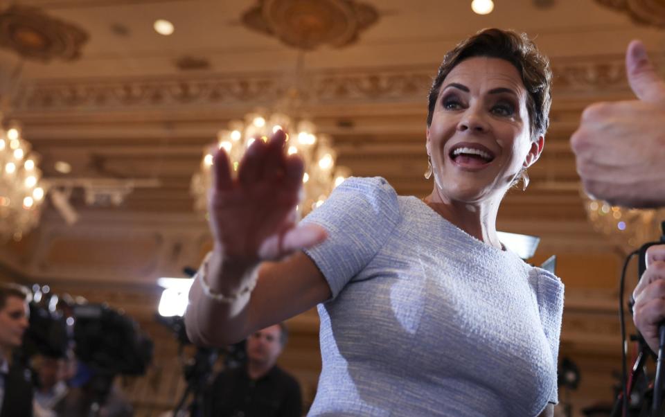 Kari Lake greets guests before the start of an event hosted by Trump at Mar-a-Lago - Joe Raedle/Getty Images North America