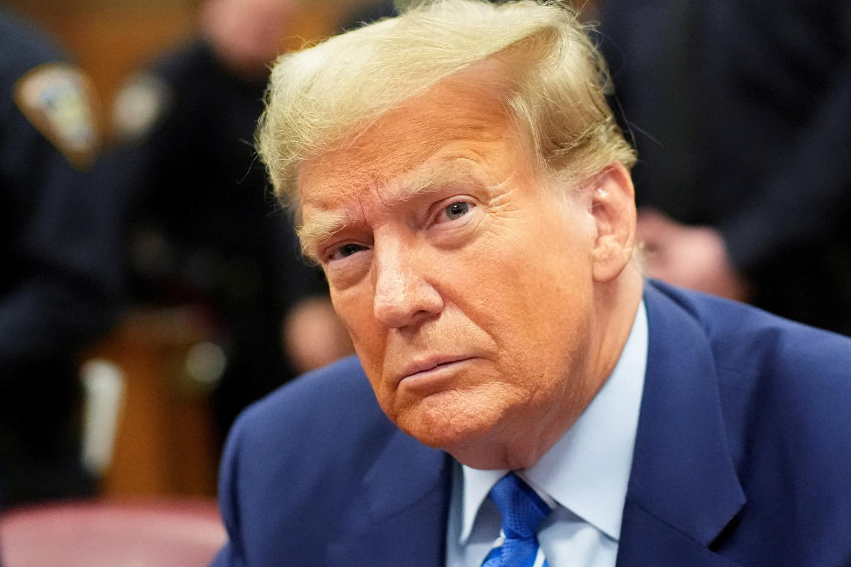 Former President Donald Trump sits inside Manhattan Criminal Court on Tuesday.