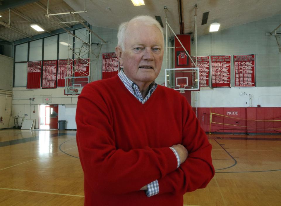 Don Kaull, a 1963 graduate of Rogers High School, in the school’s gymnasium. Kaull, the longtime radio voice of the URI Rams, has died.