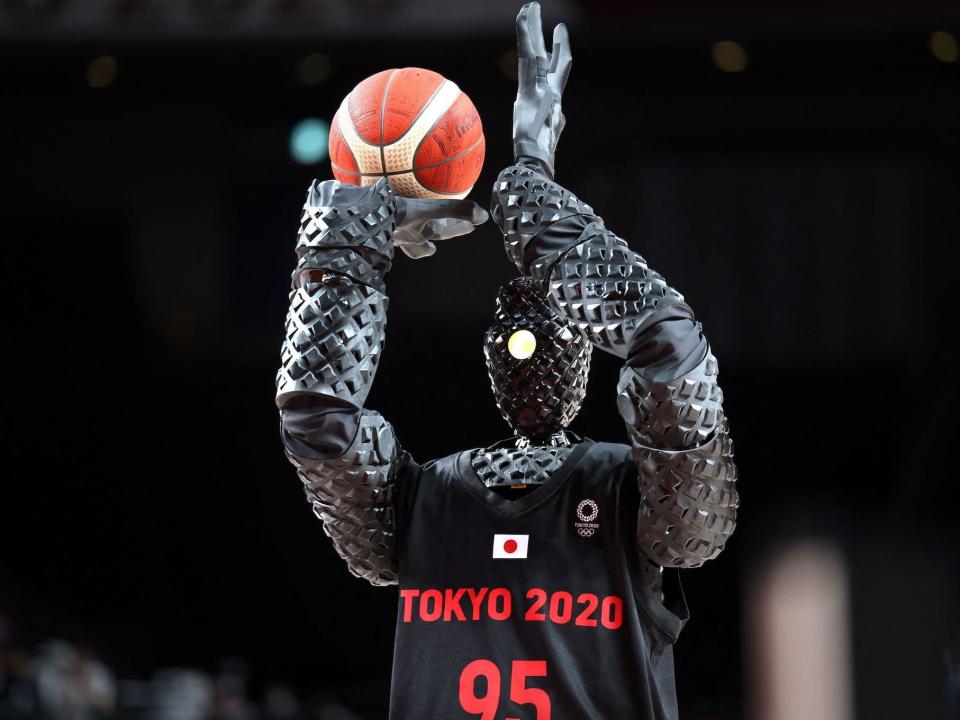 A robot shoots a basketball at the Tokyo Olympics.