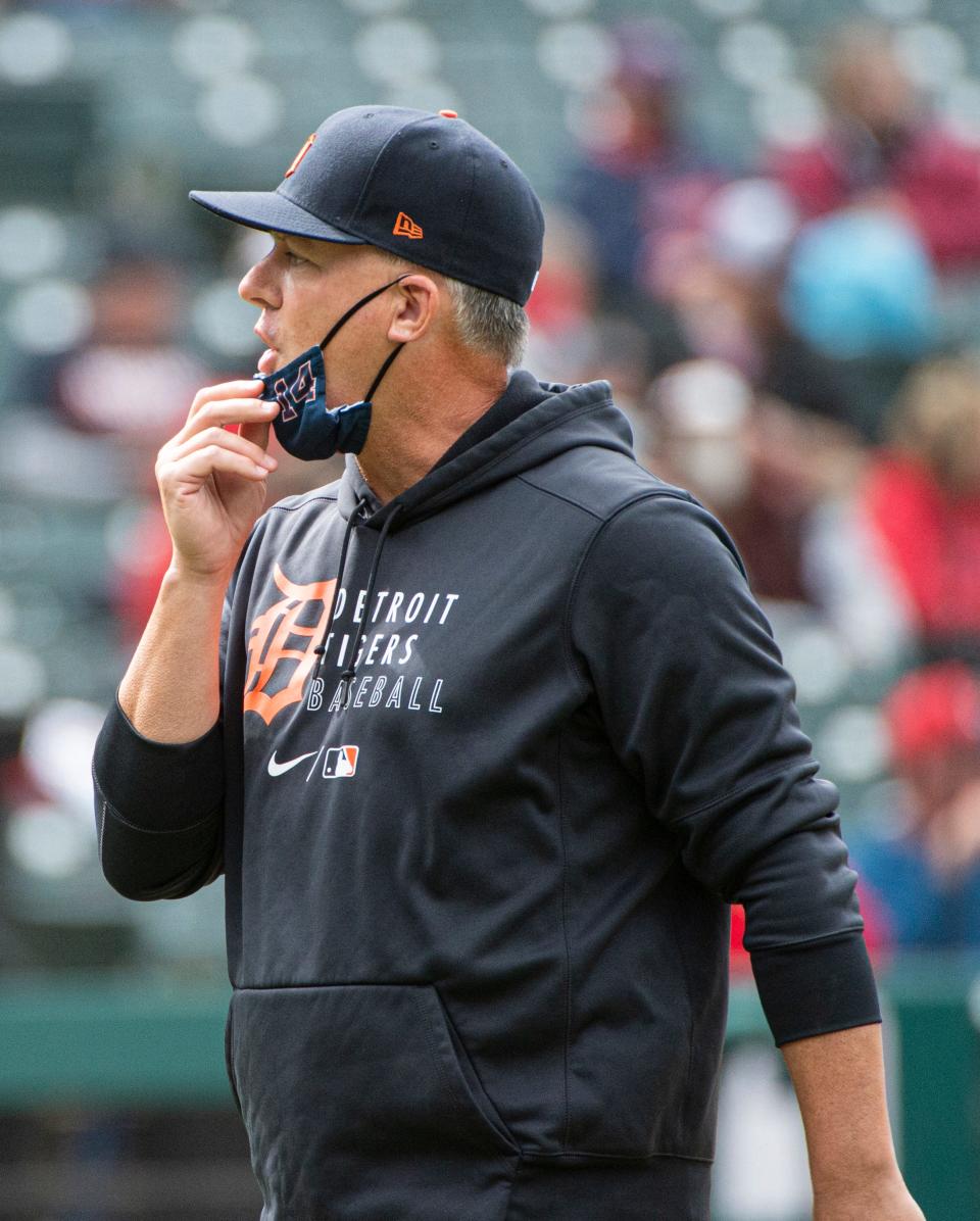 Detroit Tigers manager A.J. Hinch walks back to the dugout after making a pitching change during the eighth inning of a baseball game against the Cleveland Indians in Cleveland, Sunday, April 11, 2021. (AP Photo/Phil Long)