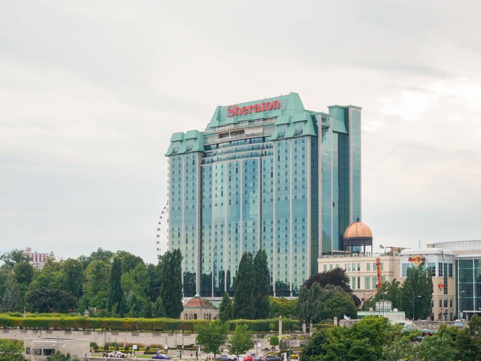 A view of the Sheraton Fallsview hotel from the middle of the Rainbow Bridge on a cloudy day.