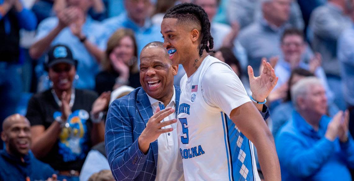 North Carolina’s Armando Bacot (5) gets a hug from coach Hubert Davis as he leaves the game with 14 points in the Tar Heels’ 84-51 victory over Noter Dame, and Bacot’s final home game on Tuesday, March 5, 2023 at the Smith Center in Chapel Hill, N.C.