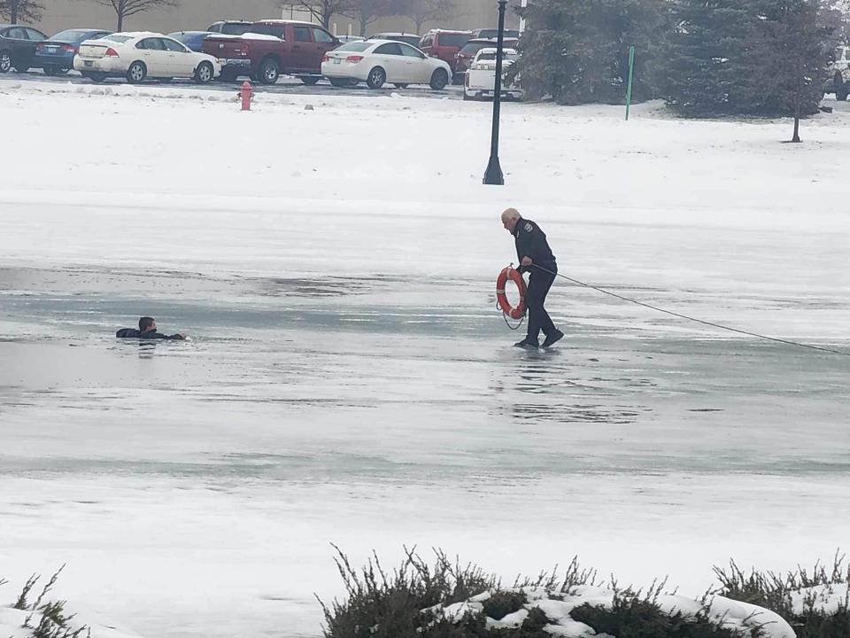 A 12-year-old boy was rescued after falling into an icy pond in Michigan on Tuesday.