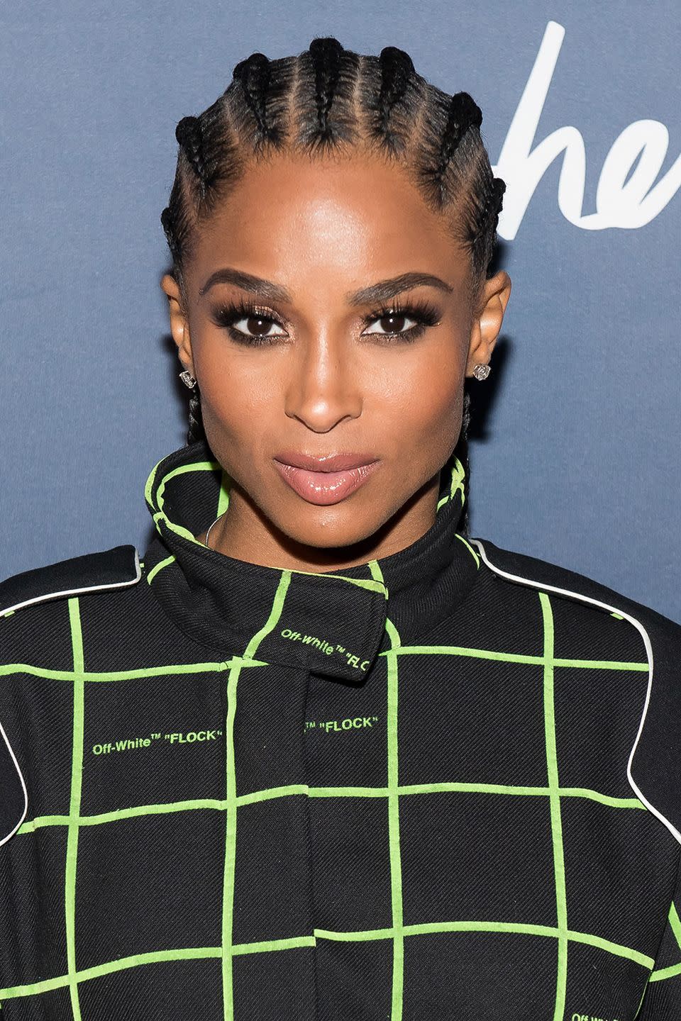 <p>Ciara wears traditional cornrows, braiding at the top of the hairline and going all the way to the nape of her neck. </p>