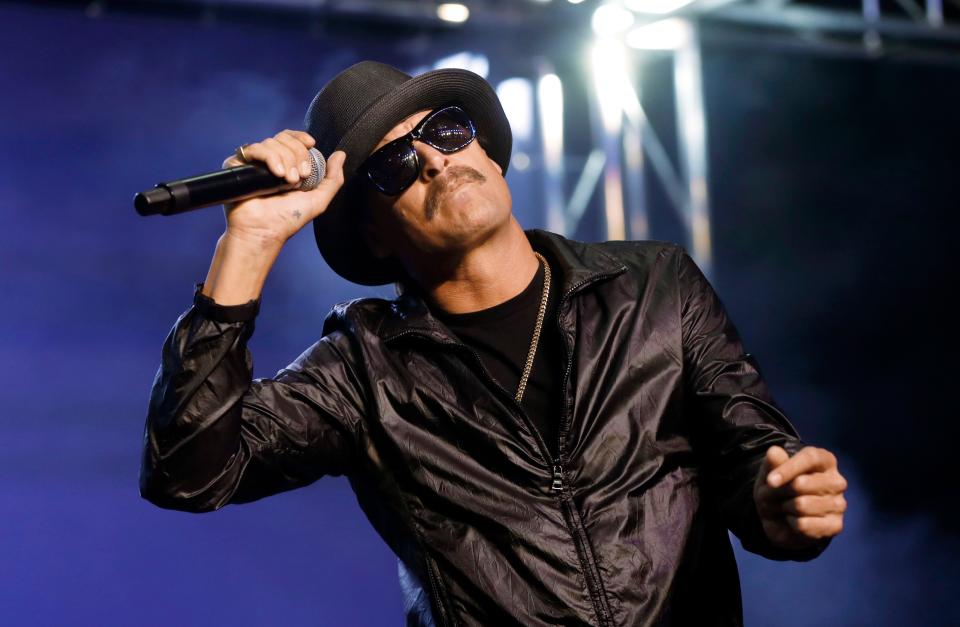FILE - In this Wednesday, Oct. 17, 2018 file photo, Kid Rock performs in Pontiac, Mich. News outlets report the 20-foot-tall (6-meter-tall) neon sign for his recently opened bar in Nashville will feature a giant guitar in which the base of the instrument is intentionally shaped like a woman’s buttocks. The mayor signed into law the council resolution authorizing the sign Friday, Jan. 4, 2019. (AP Photo/Paul Sancya)