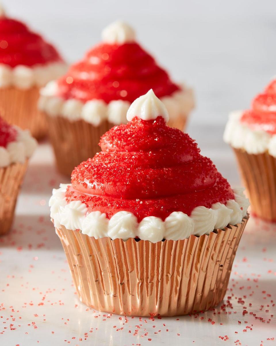 <p>Bake off your favorite <a href="https://www.delish.com/cooking/recipe-ideas/g2890/easy-cupcake-recipes/" rel="nofollow noopener" target="_blank" data-ylk="slk:cupcakes;elm:context_link;itc:0;sec:content-canvas" class="link ">cupcakes</a>, pipe a tall swirling mound of red frosting on top, then add a little white around the edges and top. You'll have the cutest Christmas dessert in no time, and everyone will be obsessed. </p><p>Get the <strong><a href="https://www.delish.com/cooking/recipe-ideas/recipes/a50541/santa-hat-cupcakes-recipe/" rel="nofollow noopener" target="_blank" data-ylk="slk:Santa Hat Cupcakes recipe;elm:context_link;itc:0;sec:content-canvas" class="link ">Santa Hat Cupcakes recipe</a></strong>.</p>
