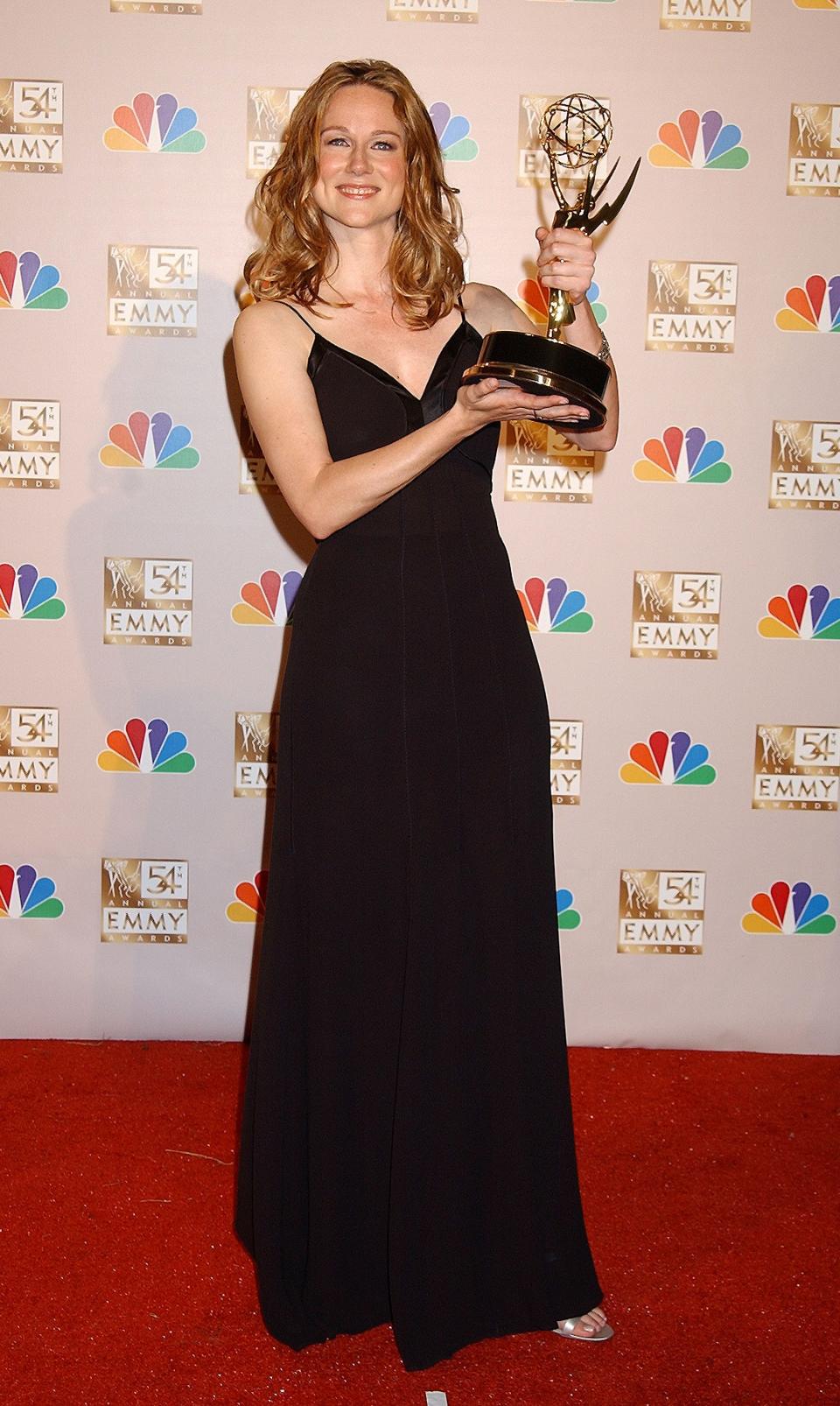 Laura Linney posing with her 2002 Emmy for lead actress in a limited series