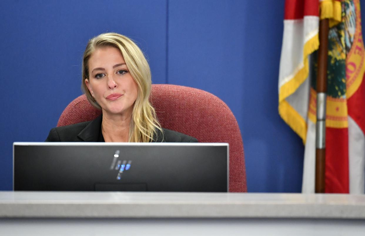 Sarasota County School Board member Bridget Ziegler listens to public comments Tuesday evening, Dec. 12, 2023, after her fellow school board members approved a resolution calling on her to resign.