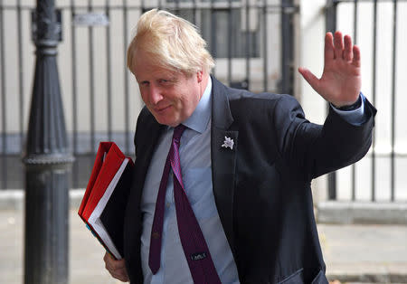 FILE PHOTO: Britain's Foreign Secretary Boris Johnson waves as he leaves Downing Street in London, Britain, June 28, 2018/File Photo