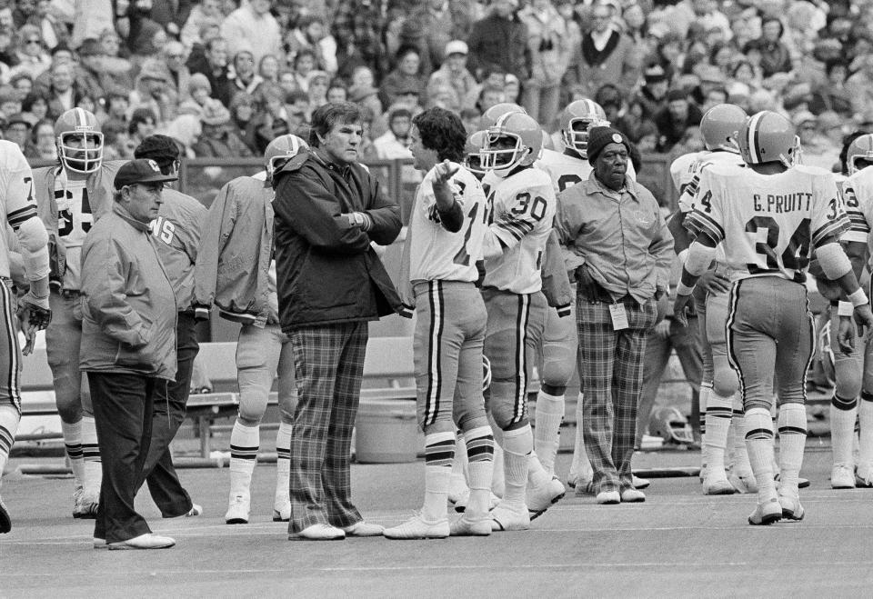 Browns coach Forrest Gregg, left, talks with quarterback Brian Sipe during a 1976 game.