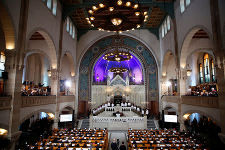 People attend a ceremony to mark the 80th anniversary of Kristallnacht, also known as the Night of Broken Glass, at Rykestrasse Synagogue, in Berlin, Germany, November 9, 2018. REUTERS/Axel Schmidt