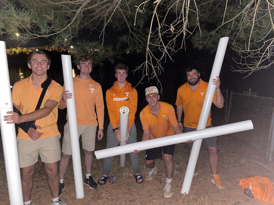 John Thome, Eli Vickers, Ben Vickers, Jake Amos, and Nick (last name unknown) post with pieces of a Neyland Stadium upright on Oct. 15, 2022.