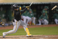 Pittsburgh Pirates' Connor Joe breaks his bat hitting a single against the Oakland Athletics during the fifth inning of a baseball game in Oakland, Calif., Tuesday, April 30, 2024. (AP Photo/Jeff Chiu)