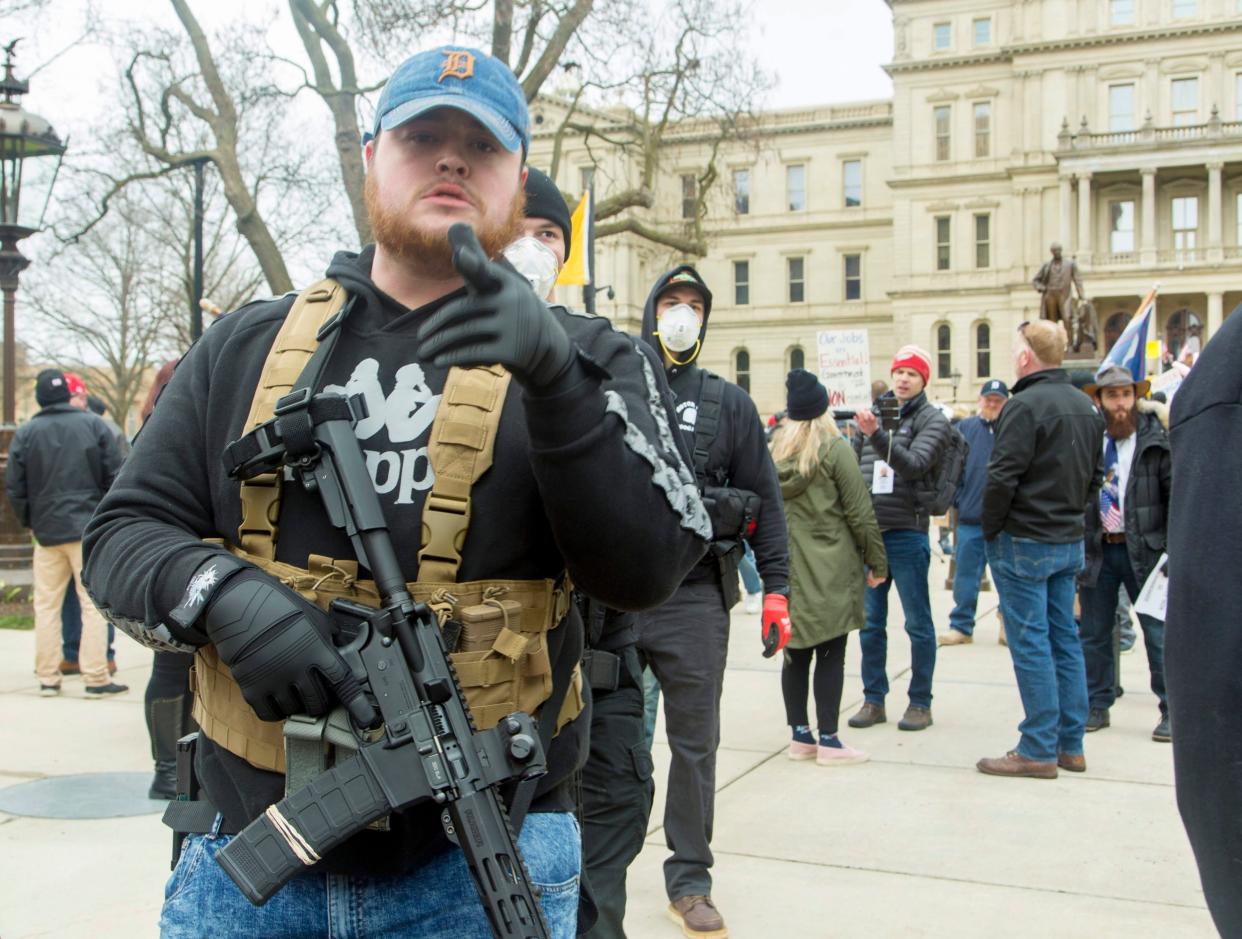 An armed protester taking part in a demonstration against coronavirus lockdown measures outside the State Capitol in Lansing, Michigan: EPA