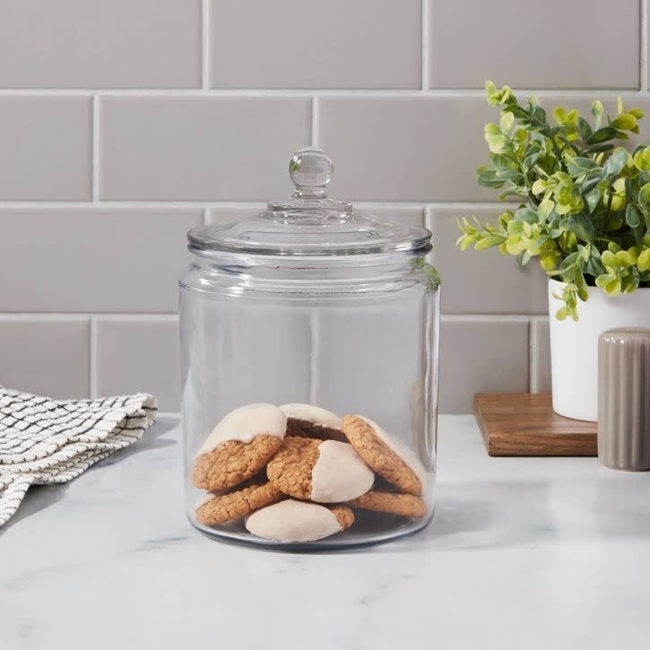 The jar on a counter with cookies inside