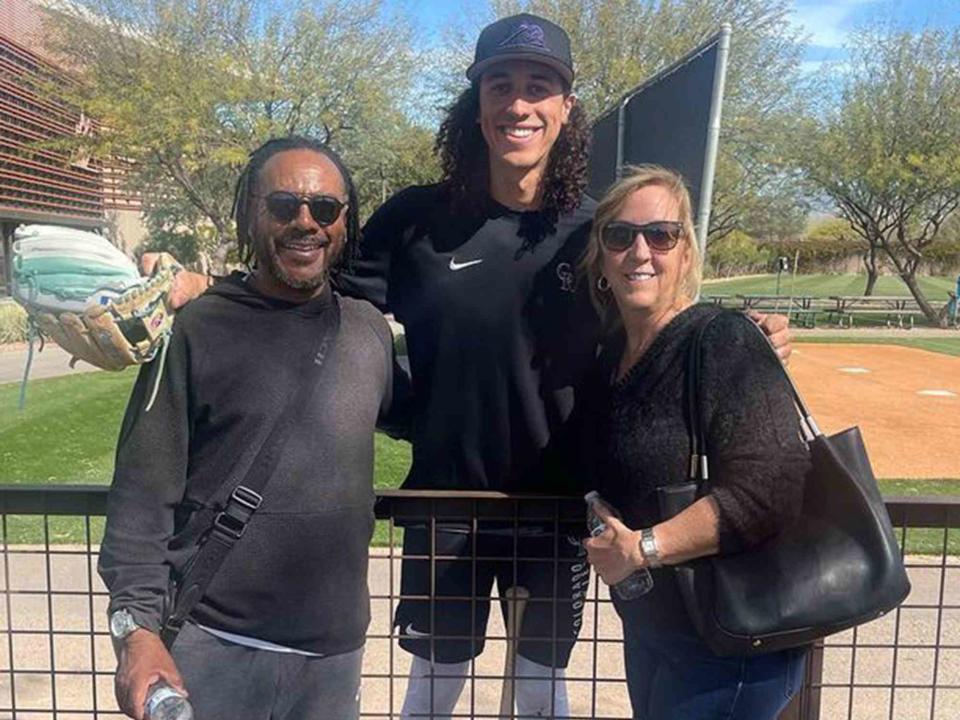 <p>Cole Tucker Instagram</p> Cole Tucker with his parents, dad Jackie and mom Erin.