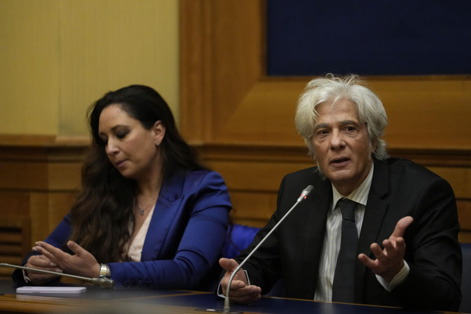 Pietro Orlandi, right, brother of Manuela, a 15-year-old daughter of a Vatican employee disappeared in 1983, is flanked by his lawyer Laura Sgro as he attends a press conference on the establishing of a parliamentary investigative commission on Manuela Orlandi and other cold cases in Rome, Tuesday, Dec. 20, 2022. (AP Photo/Alessandra Tarantino)