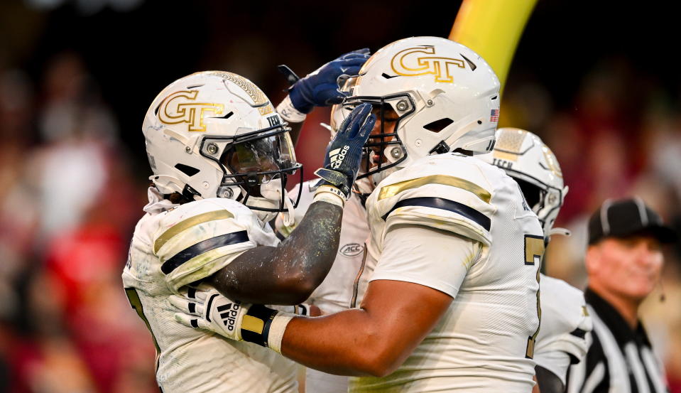 Georgia Tech Yellow Jackets running back Jamal Haynes celebrates his touchdown with Jordan Brown. (Brendan Moran/Sportsfile via Getty Images)