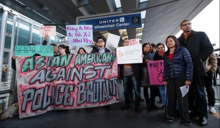 FILE PHOTO: Community members protest the treatment of Dr. David Dao, who was forcibly removed from a United Airlines flight by the Chicago Aviation Police, at O'Hare International Airport in Chicago, Illinois, U.S., April 11, 2017.  REUTERS/Kamil Krzaczynski/File Photo