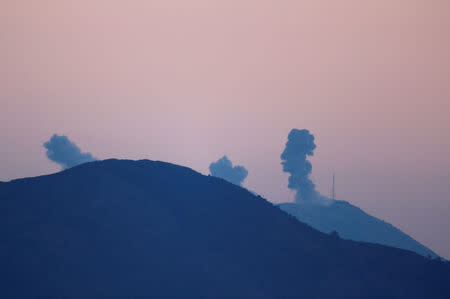 Smoke rises from the Syria's Afrin region, as it is pictured from near the Turkish town of Hassa, on the Turkish-Syrian border in Hatay province, Turkey January 20, 2018. REUTERS/Osman Orsal