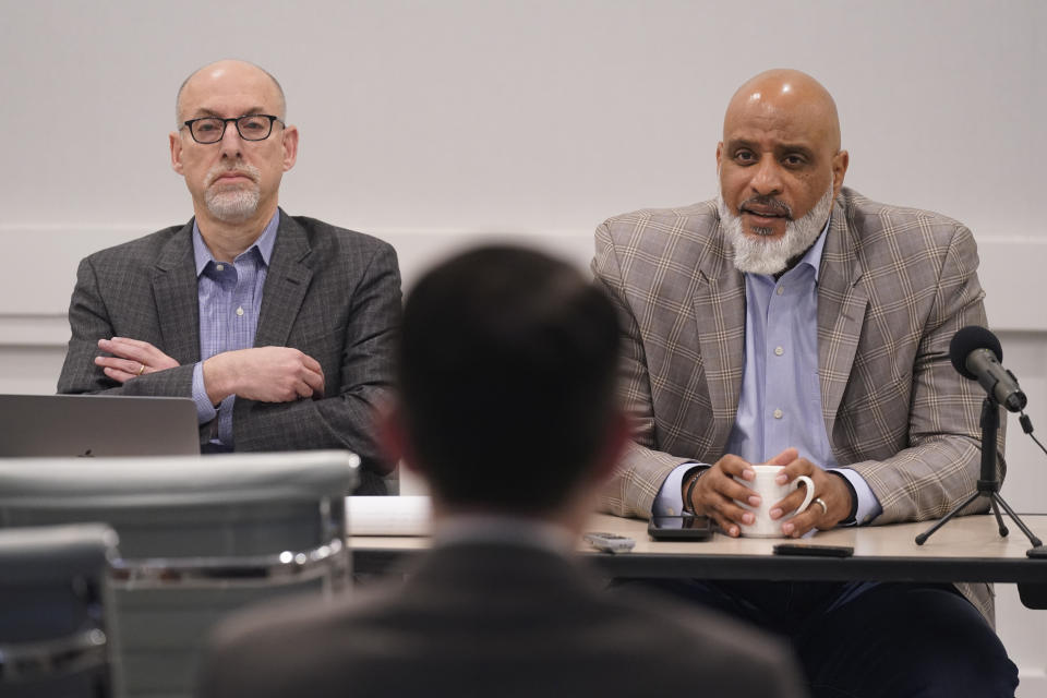 Major League Baseball union head Tony Clark, right, speaks as chief negotiator for the players association Bruce Meyer looks on during a media availability in Irving, Texas, Thursday, Dec. 2, 2021. Owners locked out players at 12:01 a.m. Thursday following the expiration of the sport's five-year collective bargaining agreement. (AP Photo/LM Otero)