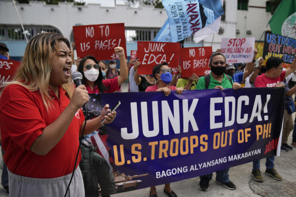 FILE -Demonstrators shout slogans as they protest against the visit of U.S. Defense Secretary Lloyd Austin III who is in the country for talks about deploying U.S. forces and weapons in more Philippine military camps during a rally outside Camp Aguinaldo military headquarters in metro Manila, Philippines on Feb. 2, 2023. The U.S. has been rebuilding its military might in the Philippines after more than 30 years and reinforcing an arc of military alliances in Asia in a starkly different post-Cold War era when the perceived new regional threat is an increasingly belligerent China. (AP Photo/Aaron Favila, File)