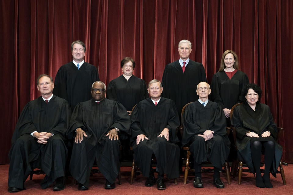 FILE - Members of the Supreme Court pose for a group photo at the Supreme Court in Washington, April 23, 2021. Seated from left are Associate Justice Samuel Alito, Associate Justice Clarence Thomas, Chief Justice John Roberts, Associate Justice Stephen Breyer and Associate Justice Sonia Sotomayor, Standing from left are Associate Justice Brett Kavanaugh, Associate Justice Elena Kagan, Associate Justice Neil Gorsuch and Associate Justice Amy Coney Barrett. (Erin Schaff/The New York Times via AP, Pool)