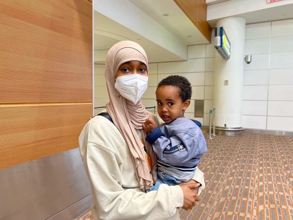 17-year-old Fatima Sherefa was happy to be reunited with her family in Winnipeg after an 18-hour delay at Toronto Pearson Airport. (Joanne Roberts/CBC - image credit)